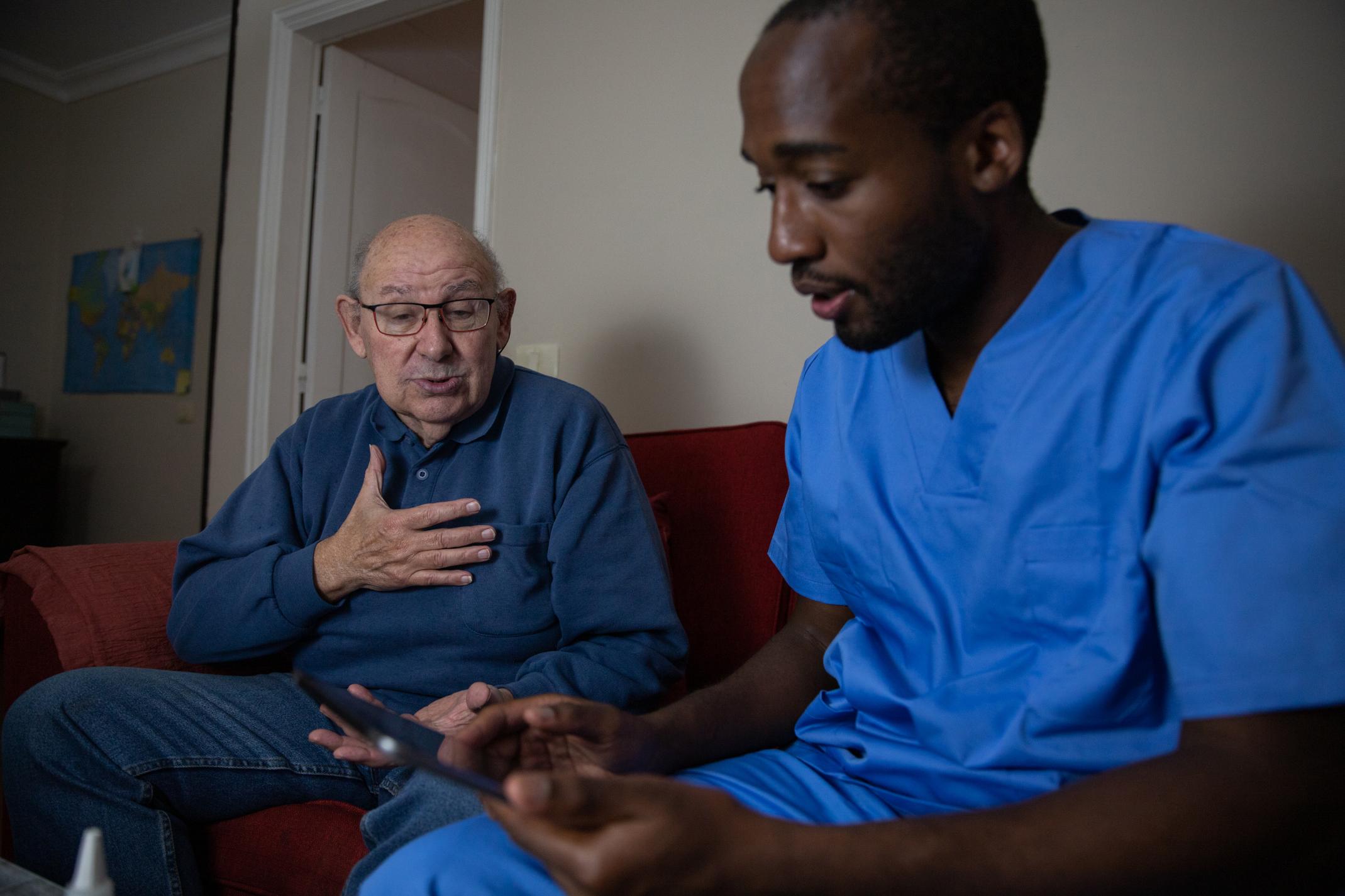 an-elderly-patient-touches-his-chest-in-pain-durin-2025-03-10-02-09-20-utc
